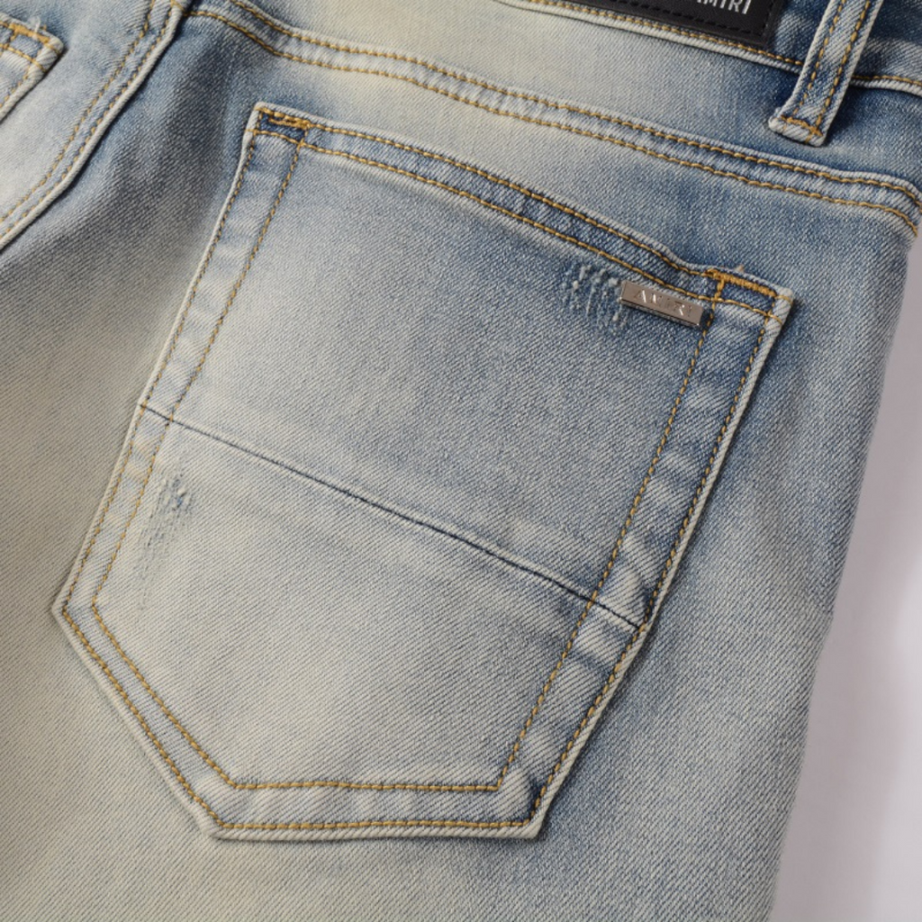 Amiri Camo Logo Jeans: Stylische Designer Stretch Denim Hose mit Tarnmuster