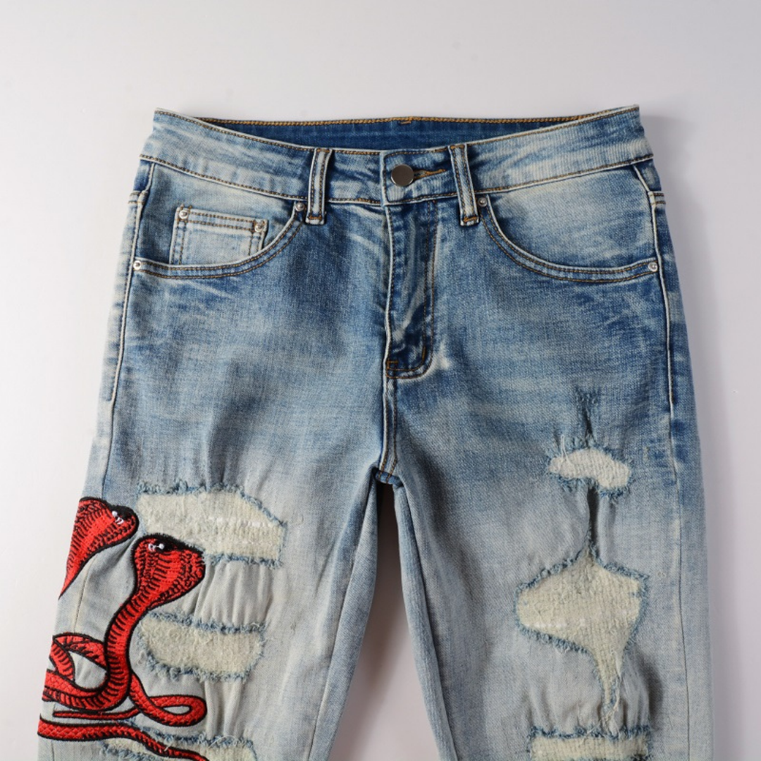Amiri Fire Snake Jeans: Luxuriöse Designer-Denim mit feuriger Schlangenstickerei