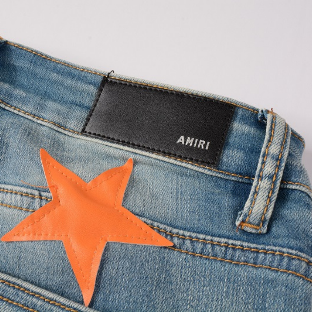 Amiri Slim Fit Designer Jeans mit Orangefarbenen Stern-Patches für Herren